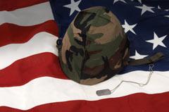 American flag and soldier's helmet